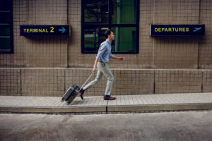 man running to his airport gate