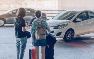 travelers waiting for airport shuttle